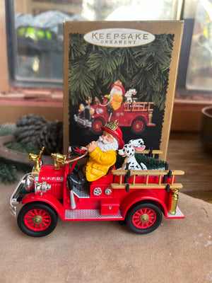 Red fire truck ornament and vintage collectible with Santa Claus figure and Dalmatian Dog 