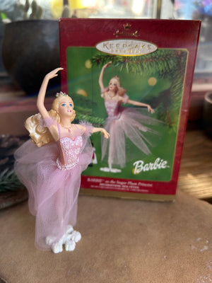 A Hallmark Keepsake Label Barbie Sugar Plum Princess Ballerina Ornament, featuring Barbie in a pink tutu dancing on a snowflake