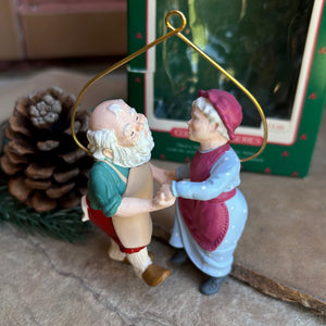Mr. and Mrs. Santa Claus dancing the night away getting prepared for the holiday season