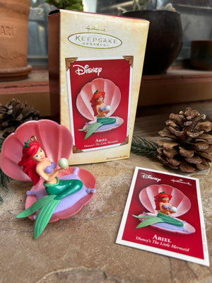 Princess Ariel Mermaid ornament and includes commemorative collectors card on a textured surface