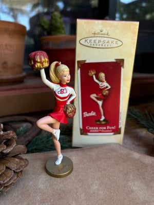 Energetic Cheerleader ornament with red and white uniform and matching pom pons 