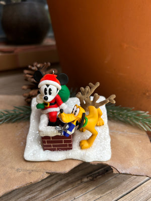 Disney's Mickey and Pluto as Santas helpers on the chimney top ready to leave the children their Christmas Gifts! 
