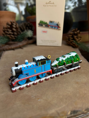 Model train set on a reflective surface with a blurred background