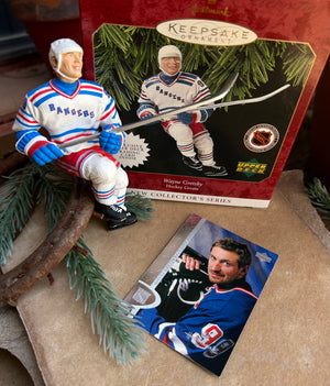 Hockey-themed collectible figure with packaging and a photo of a hockey player on a brown surface.