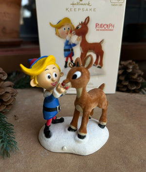 Rudolph the Red Nose Reindeer and Hermey Christmas ornament on a snow heap and yes, Rudolph's  nose lights up with batteries 