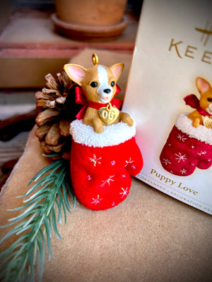 from the Puppy love hallmark series this is the 16th ornament featuring and adorable chihuahua Dog with charm and bright red bow  in a red christmas stocking 