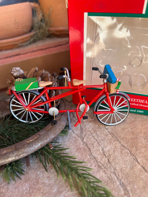 A red sweetheart bicycle ornament from Hallmark, designed with intricate details new in box 