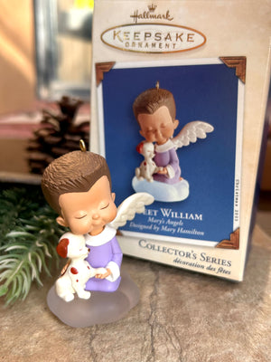 Hallmark Keepsake William Angel Ornament, new in box, featuring a figurine of a boy with an angel on his shoulder, against a blue and white vintage collectible