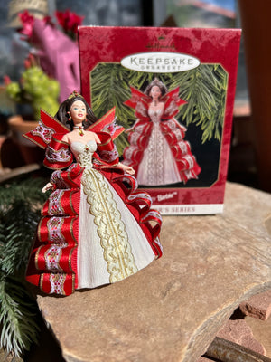 Barbie Keepsake Ornament fifth in the Barbie Collection featured in a beautiful red gown with cascading ribbons and lace 